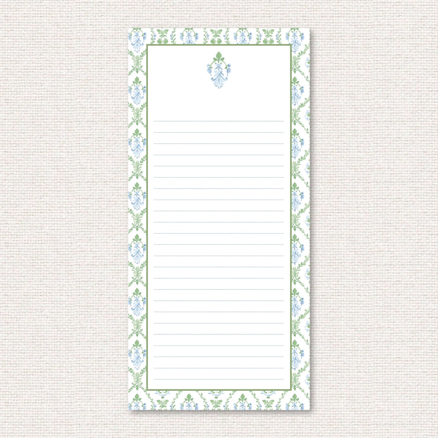 The Vera Suite list pad, a grand-millennial pattern of a blue floral damask with greenery