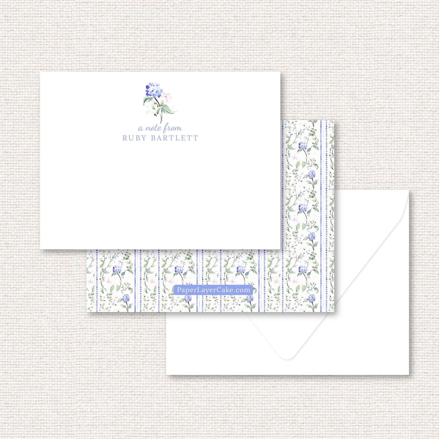 The Eloise Suite flat note, blue hydrangeas and pink flowers with dotted vertical lines