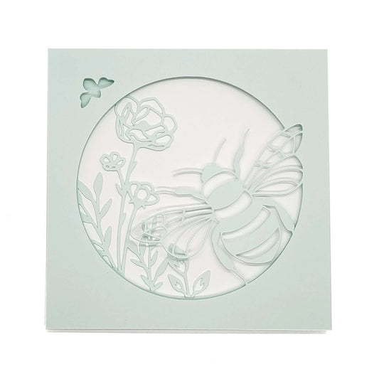 Die cut, layered card of  bee with flowers on light aqua card stock