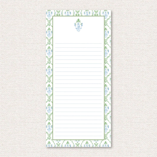 The Vera Suite list pad, a grand-millennial pattern of a blue floral damask with greenery