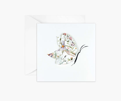 Butterfly die cut from floral patterned paper and layered