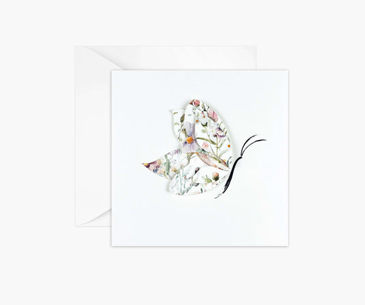 Butterfly die cut from floral patterned paper and layered