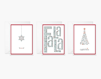 Set of 3 Christmas cards with festive reds and light blue. An ornament with crystals on the string, FaLaLa die cut, and a blue and red botanical Christmas tree