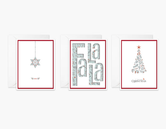 Set of 3 Christmas cards with festive reds and light blue. An ornament with crystals on the string, FaLaLa die cut, and a blue and red botanical Christmas tree