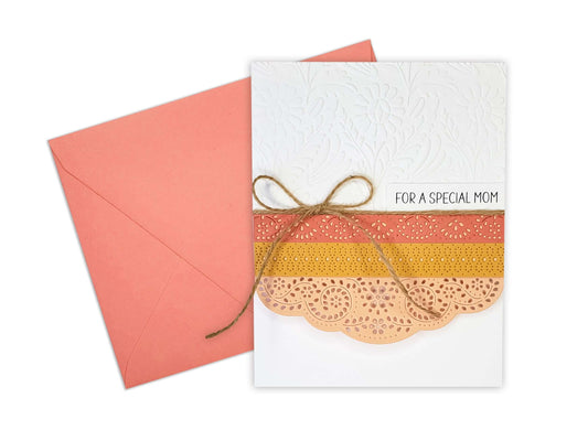 White embossed Mother's Day card with 3 die cut layers and a twine bow