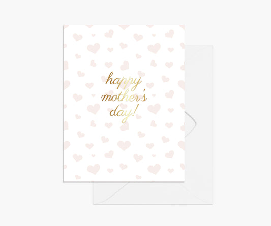 Happy Mother's Day in gold foil on a background pattern of watercolor pink hearts