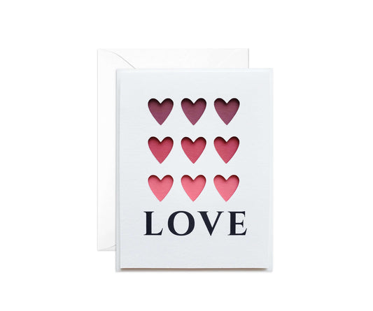9 Die cut hearts with a pink gradient background with the word LOVE below.