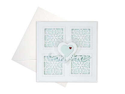 Mother's Day card with 4 squares with die cut motifs, 3 layered hearts in the center with die cut mom underneath. Light Aqua colors with white