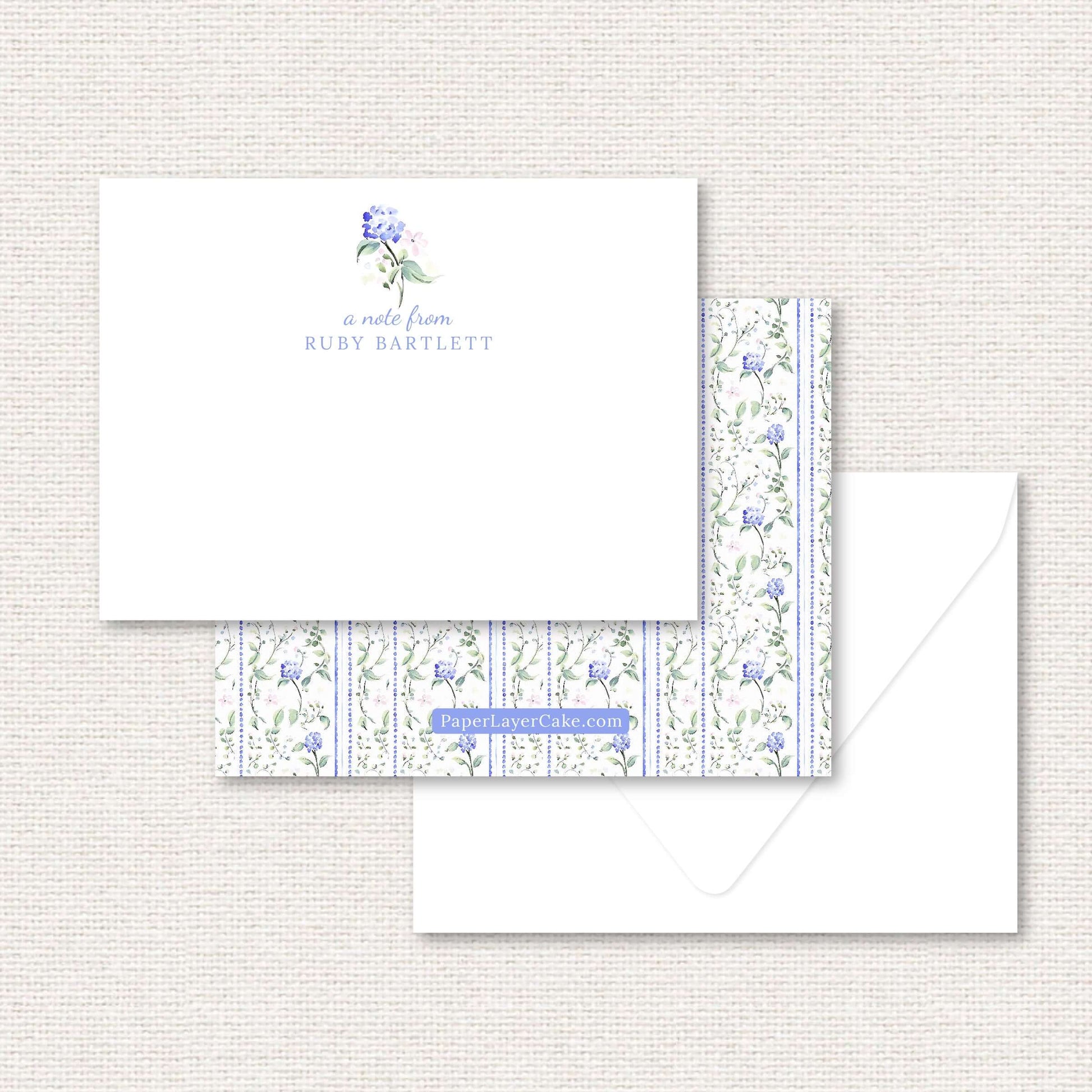 The Eloise Suite flat note, blue hydrangeas and pink flowers with dotted vertical lines