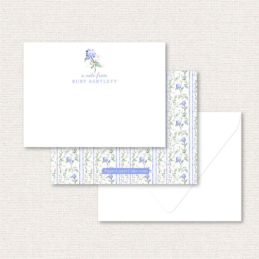 The Eloise Suite flat note, blue hydrangeas and pink flowers with dotted vertical lines