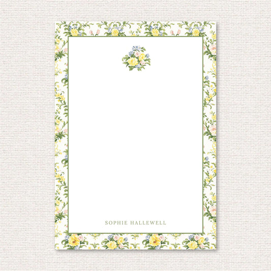 The Penelope Suite personalized notepad, a grand-millennial pattern of yellow, blue, and pink rose damask