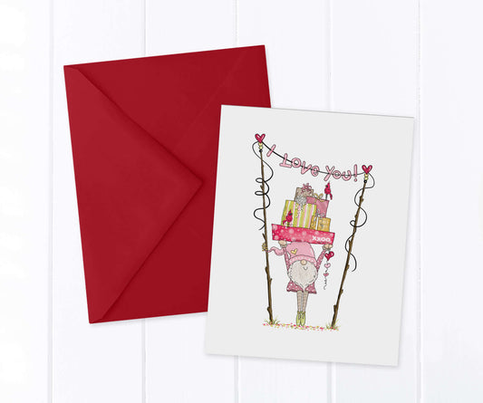 Valentine Gnome holding a stack of presents over his head under an i love you banner